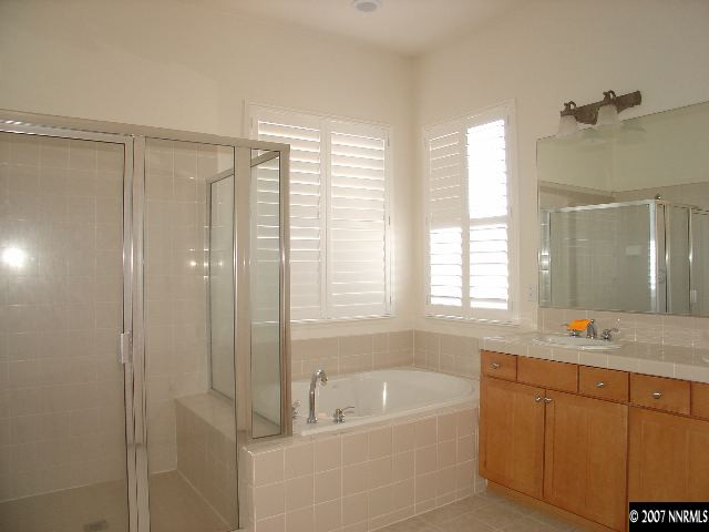 1637 Moquith Court Reno, NV 89521 - Photo 5 of 7 a bathroom with a tub a sink and window