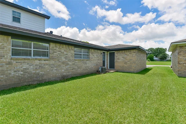 a backyard of a house with lots of green space