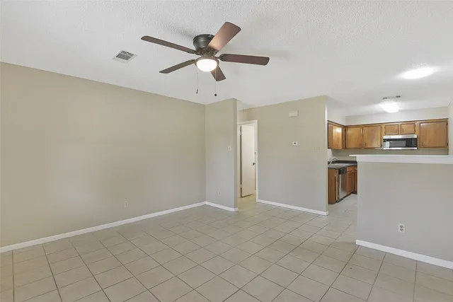a view of a kitchen with a sink and cabinets