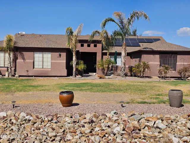 a front view of a house with yard