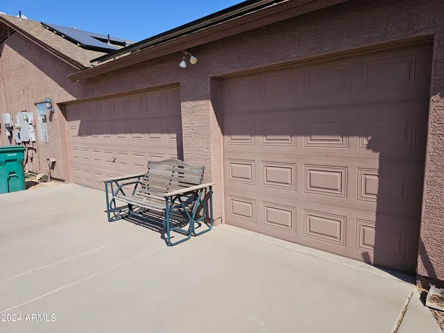 a spacious bedroom with a bed and furniture