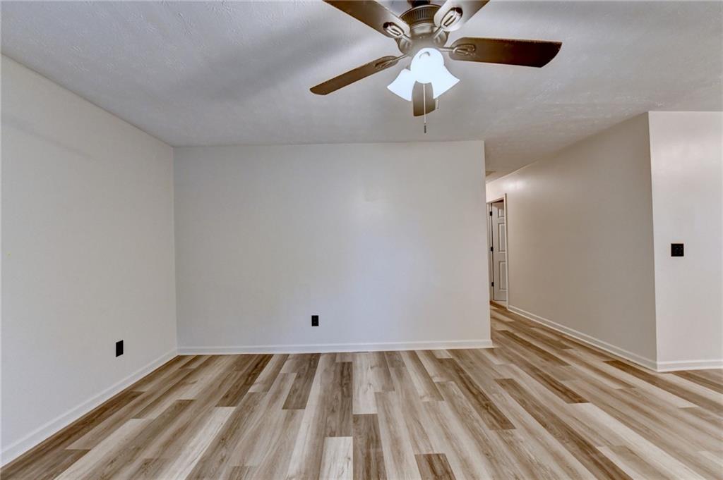 801 Davis Street Monroe, GA 30655 - Photo 8 of 33 wooden floor in an empty room