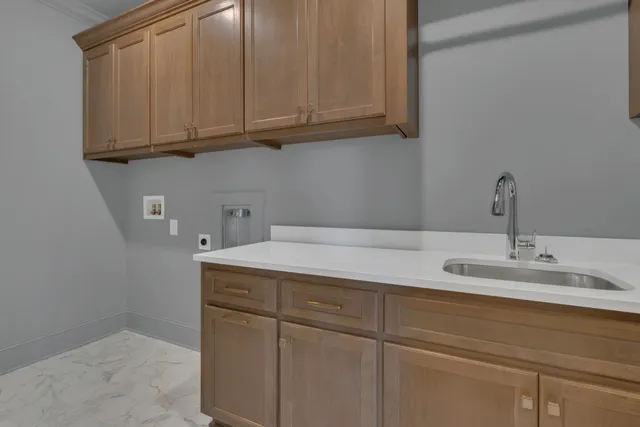 a bathroom with a sink and cabinets