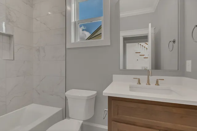 a bathroom with a sink toilet and vanity