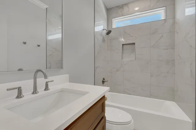 a bathroom with a sink toilet and bathtub