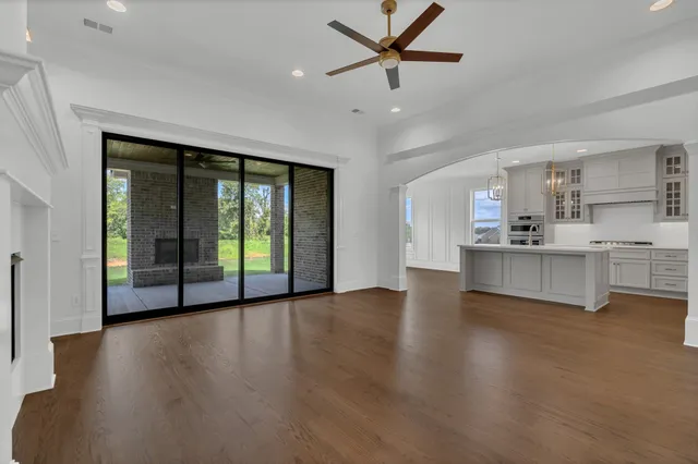 a view of a kitchen with a sink and a window