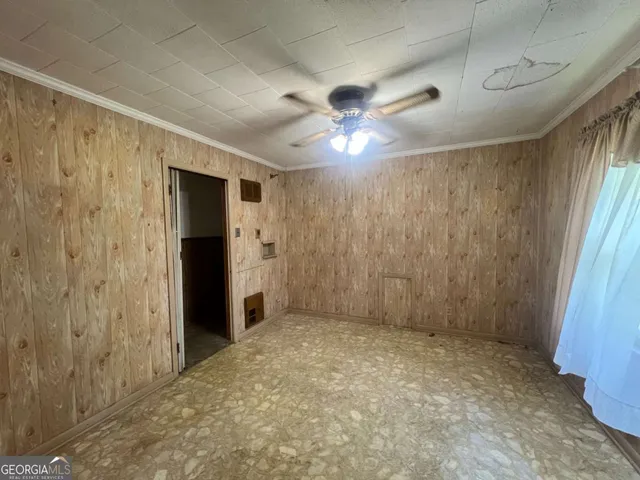 a large kitchen with kitchen island a sink stainless steel appliances and cabinets