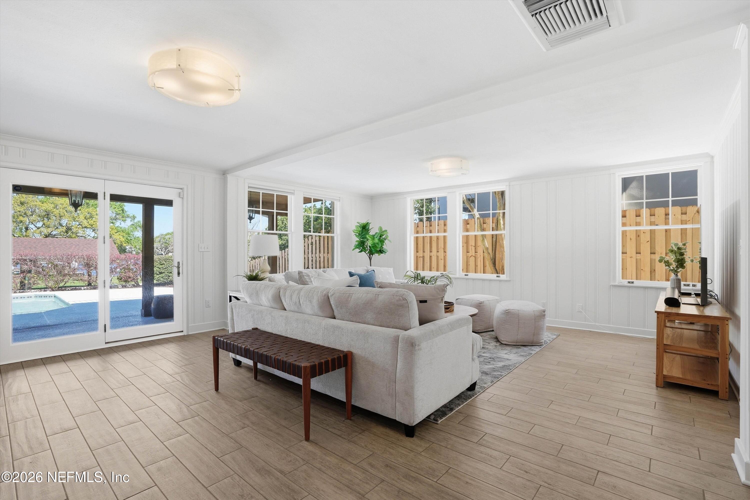 833 Sorrento Road Jacksonville, FL 32207 - Photo 11 of 68 a living room with furniture and a large window