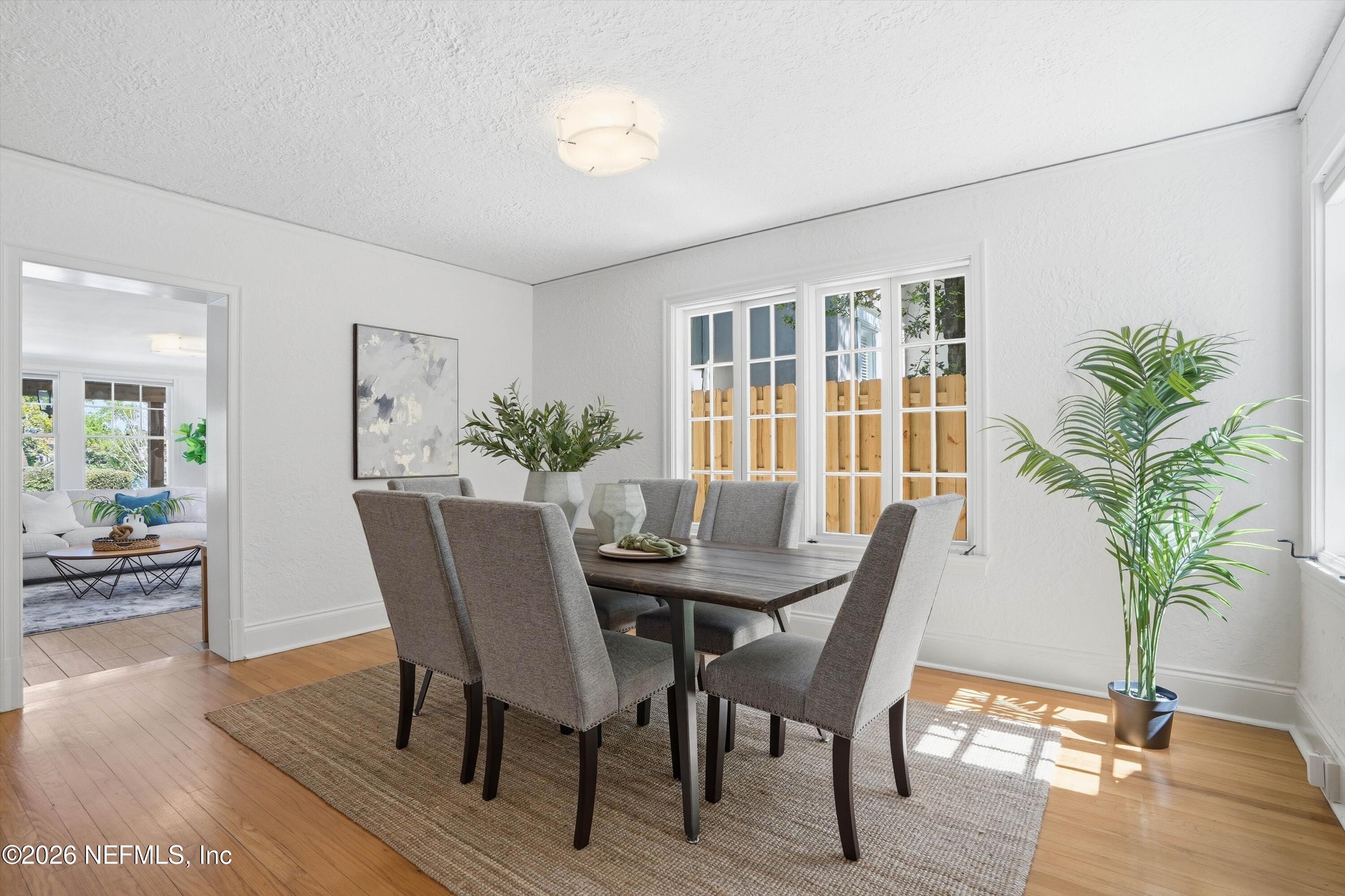 833 Sorrento Road Jacksonville, FL 32207 - Photo 19 of 68 a view of a dining room with furniture window and wooden floor