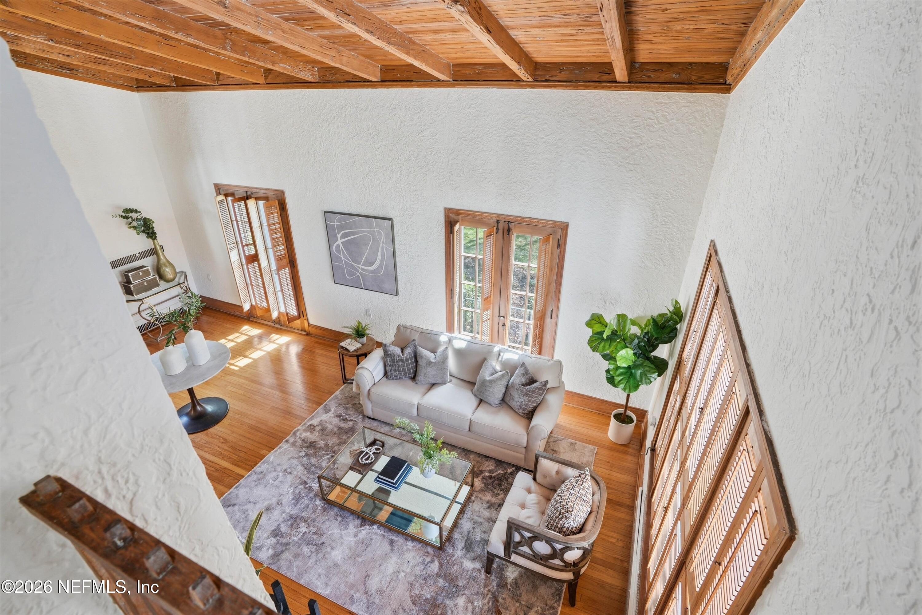 833 Sorrento Road Jacksonville, FL 32207 - Photo 23 of 68 a living room with furniture and a floor to ceiling window