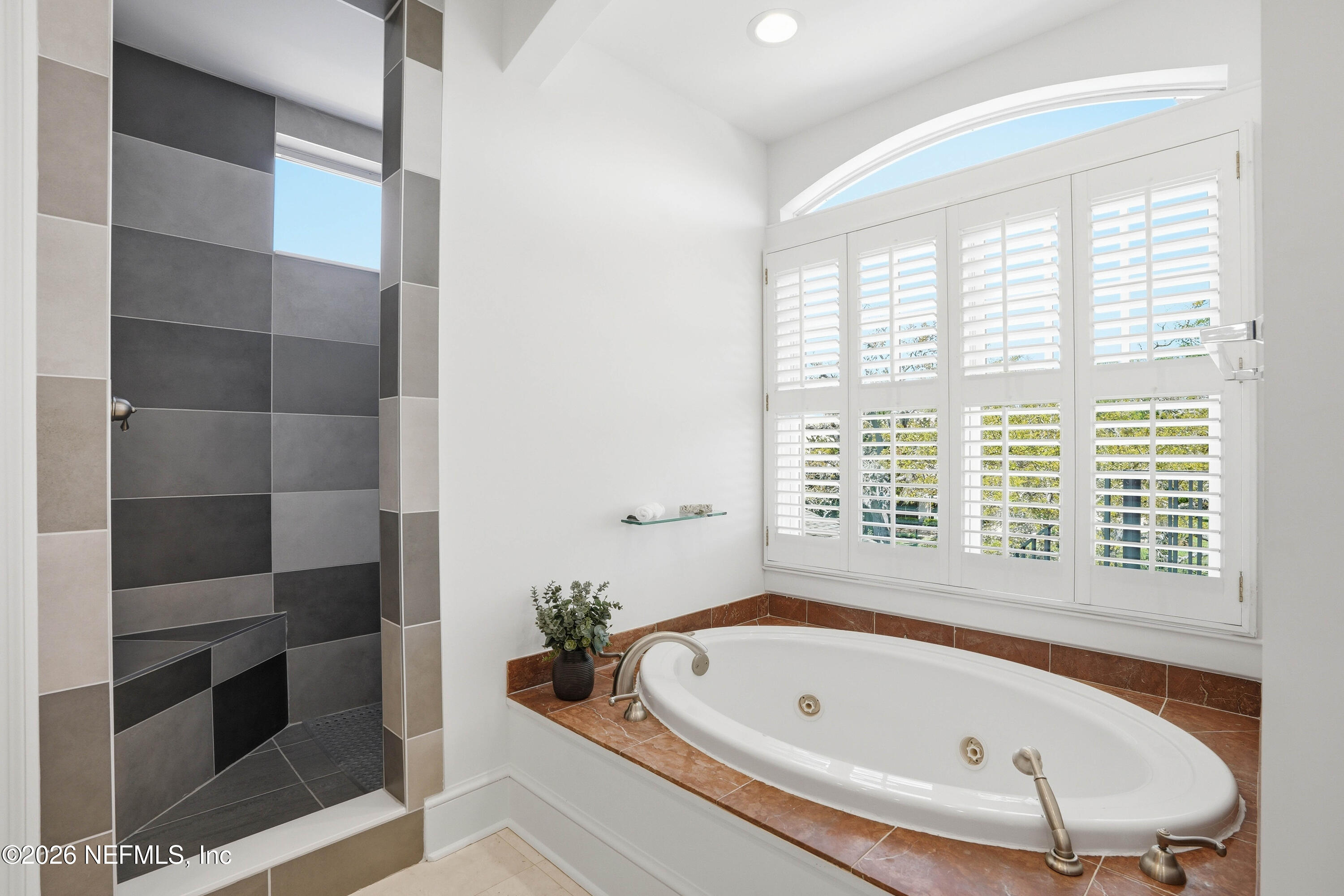 833 Sorrento Road Jacksonville, FL 32207 - Photo 28 of 68 a bathroom with a bathtub and a window