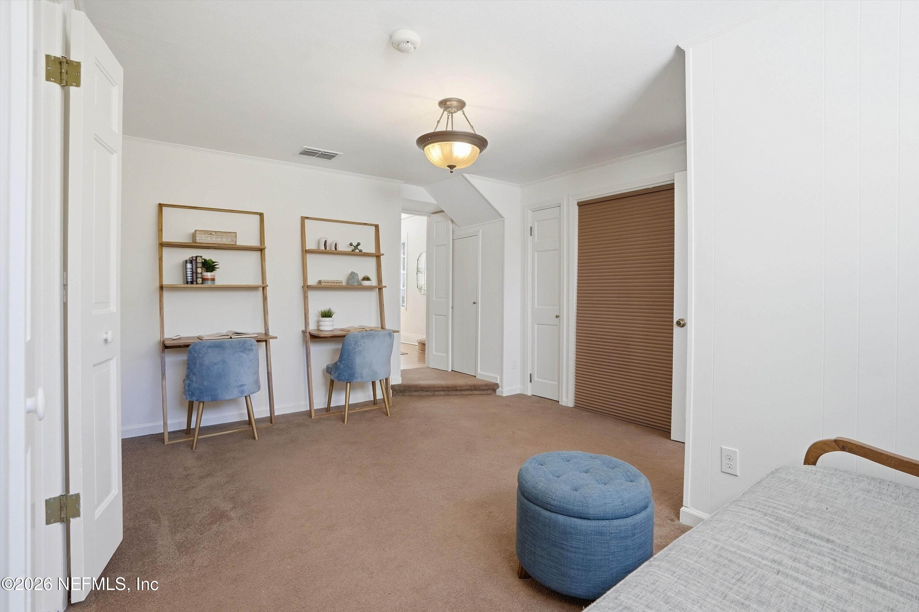 833 Sorrento Road Jacksonville, FL 32207 - Photo 34 of 68 a living room with furniture and a lamp