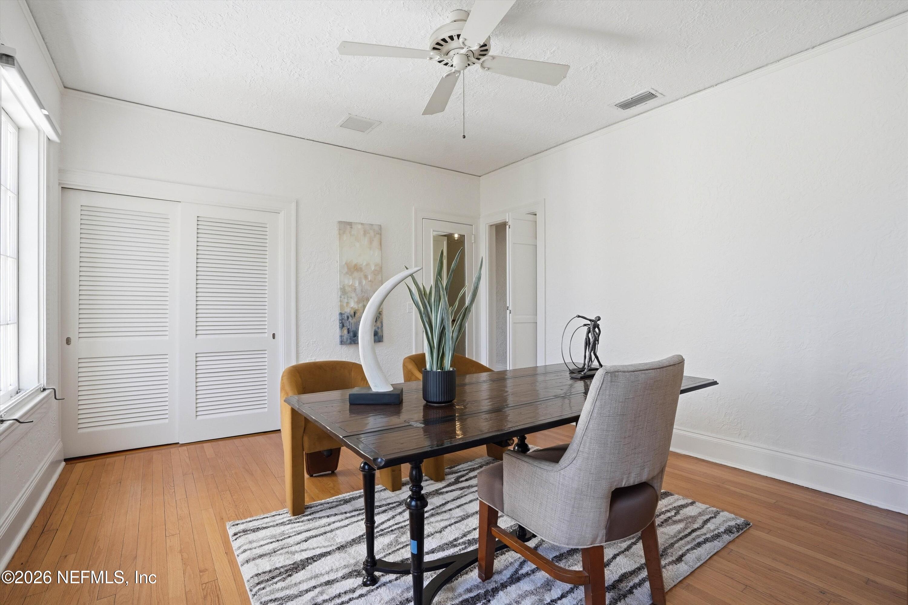 833 Sorrento Road Jacksonville, FL 32207 - Photo 35 of 68 a view of a dining room with furniture window and wooden floor