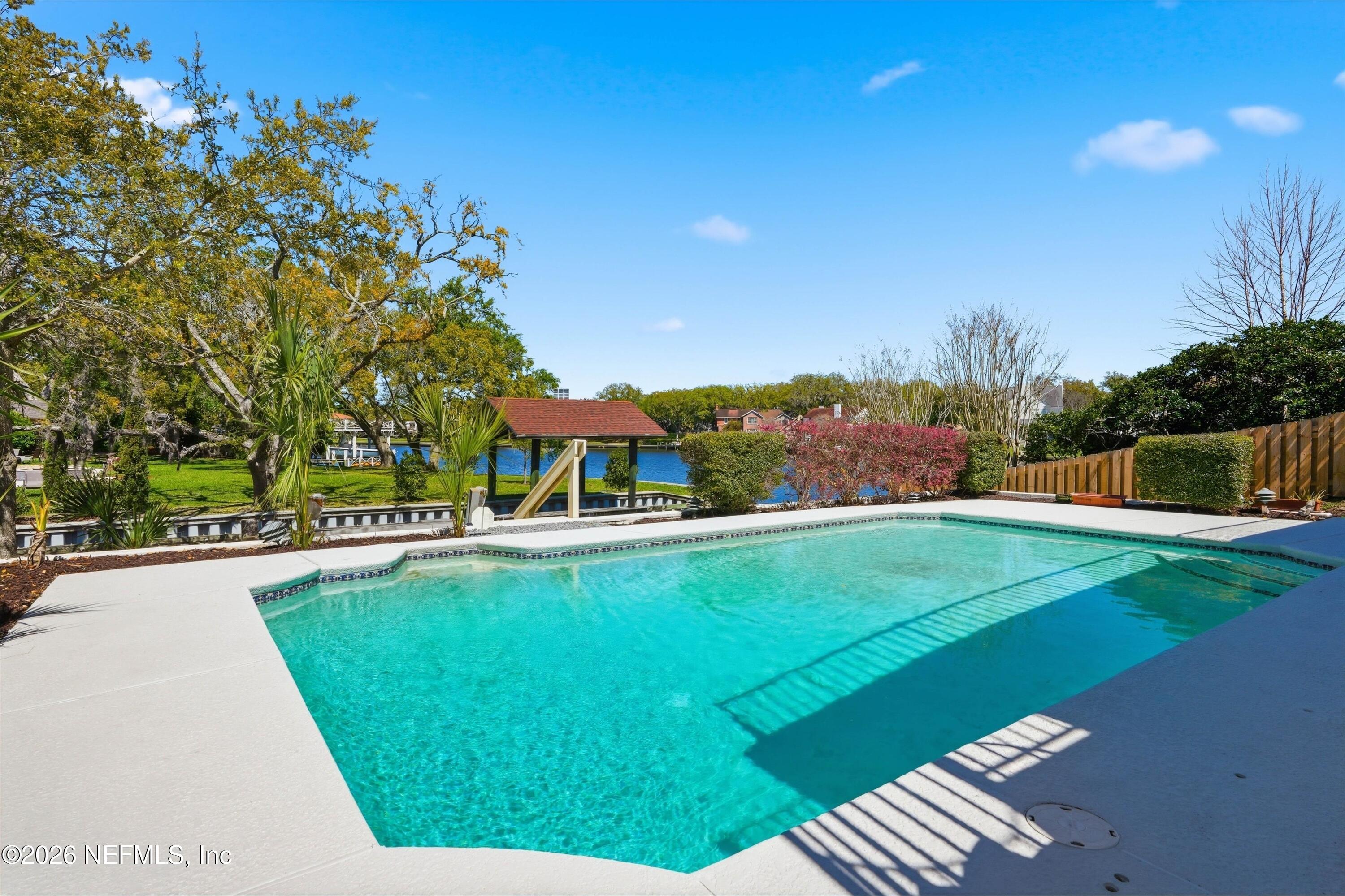 833 Sorrento Road Jacksonville, FL 32207 - Photo 46 of 68 a view of a swimming pool with a yard
