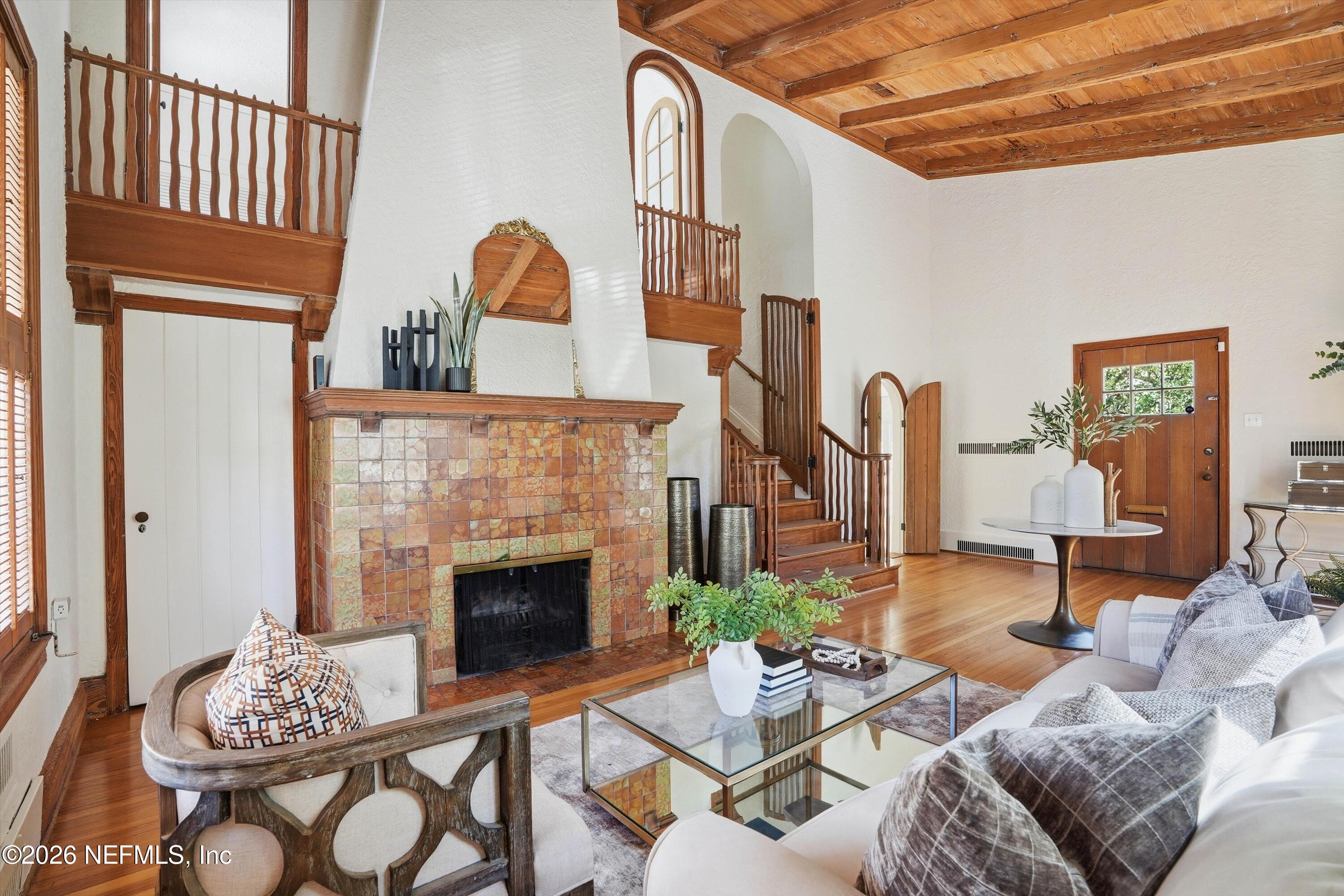 833 Sorrento Road Jacksonville, FL 32207 - Photo 7 of 68 a living room with furniture a fireplace and a table