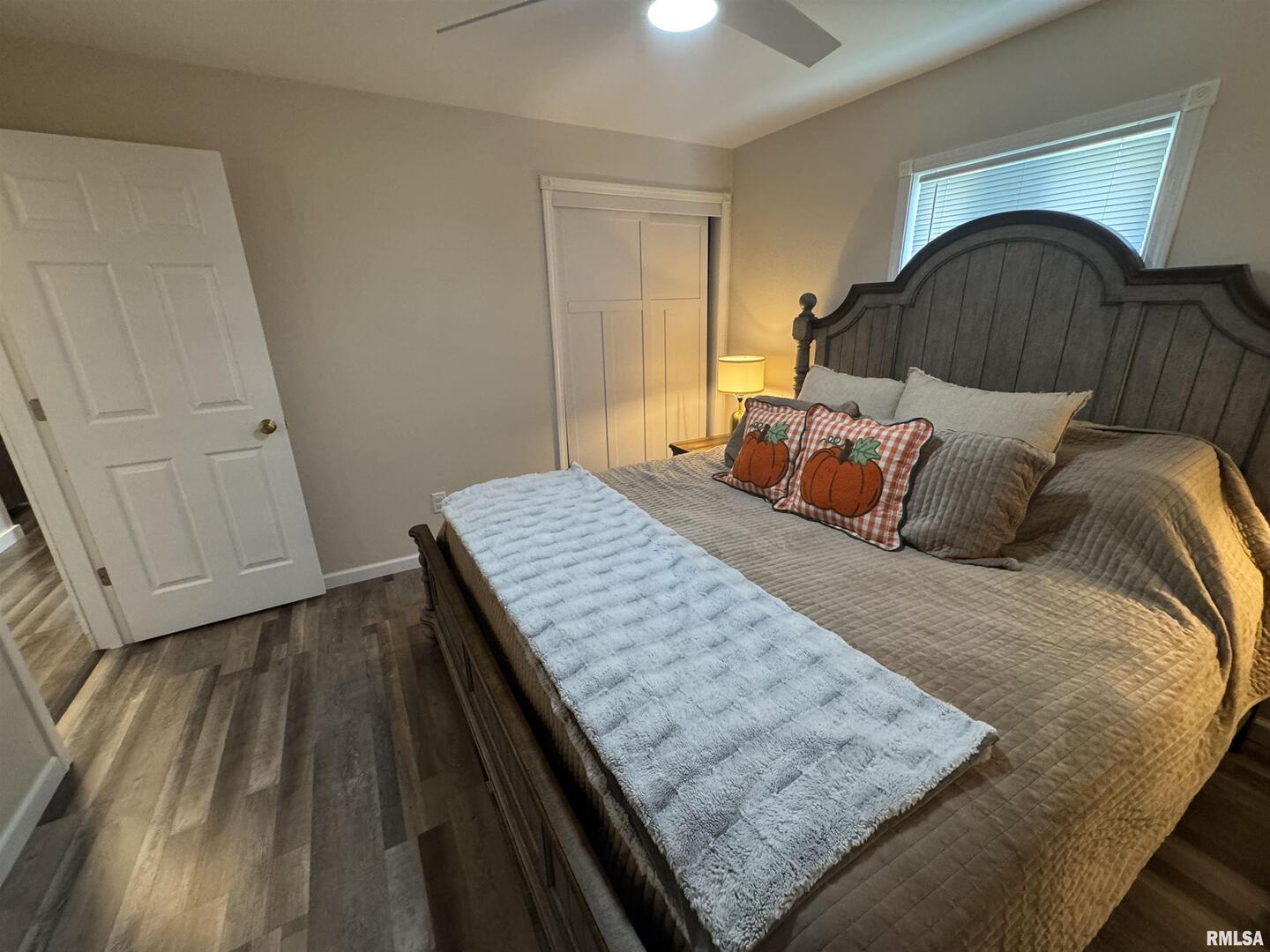 801 West 5th Street Flora, IL 62839 - Photo 16 of 48 a bedroom with a bed and wooden floor