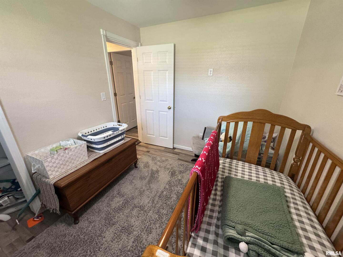 801 West 5th Street Flora, IL 62839 - Photo 20 of 48 a bedroom with furniture and a book shelf