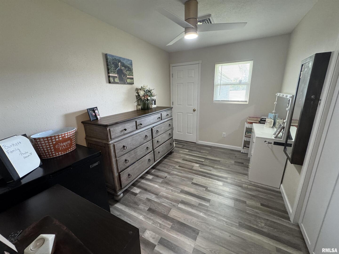 801 West 5th Street Flora, IL 62839 - Photo 21 of 48 a room with a bed cabinets and a flat tv screen