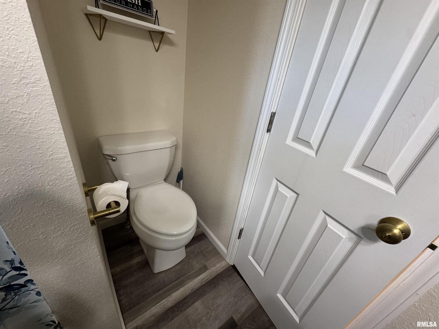 801 West 5th Street Flora, IL 62839 - Photo 24 of 48 a bathroom with a toilet and a shower