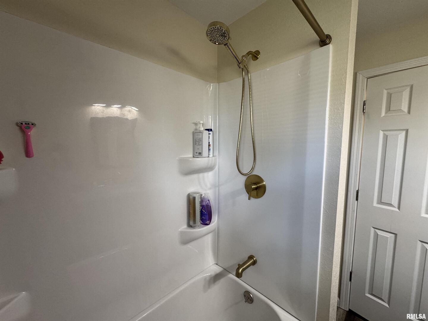 801 West 5th Street Flora, IL 62839 - Photo 26 of 48 a bathroom with a shower