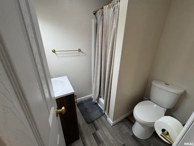 a bathroom with a toilet and a sink