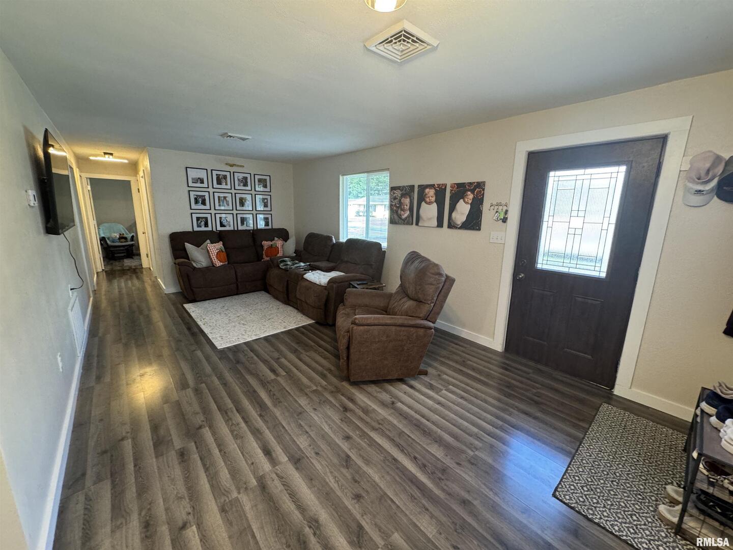 801 West 5th Street Flora, IL 62839 - Photo 4 of 48 a living room with furniture and a wooden floor