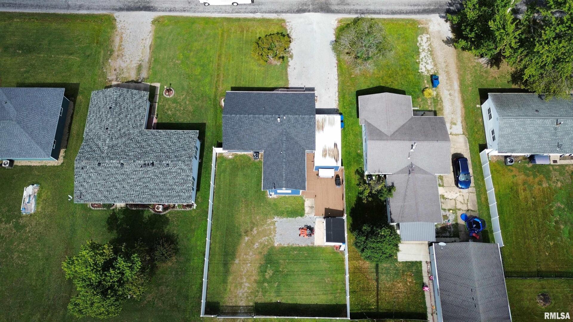 801 West 5th Street Flora, IL 62839 - Photo 43 of 48 an aerial view of a house with a swimming pool