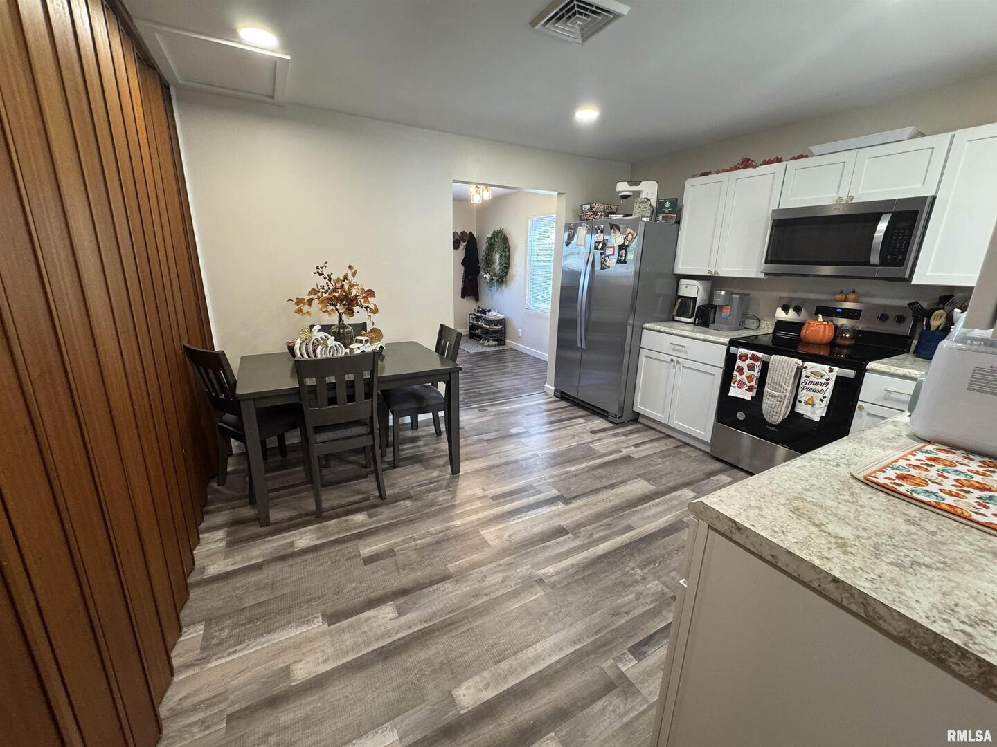 801 West 5th Street Flora, IL 62839 - Photo 8 of 48 a living room with furniture and a flat screen tv