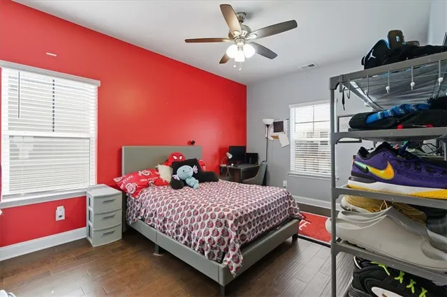 a bedroom with a bed and a desk