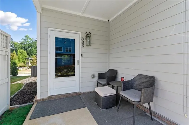 a couple of chairs sitting in backyard of house