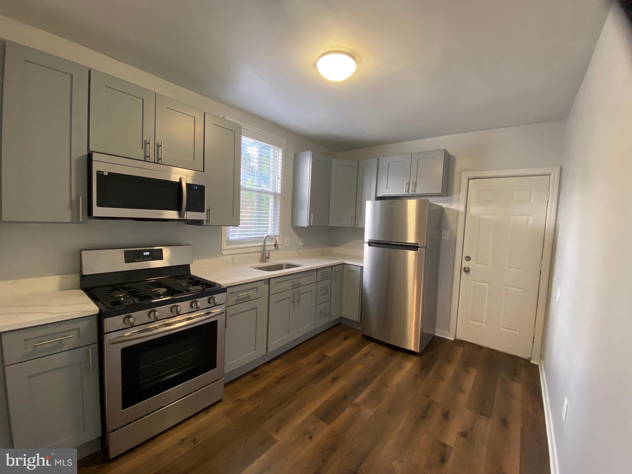 3414 Garrison Boulevard Baltimore, MD 21215 - Photo 11 of 60 Unit 1 Kitchen with Stainless Appliances