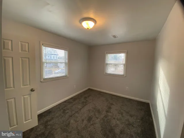 a kitchen with sink stove and microwave