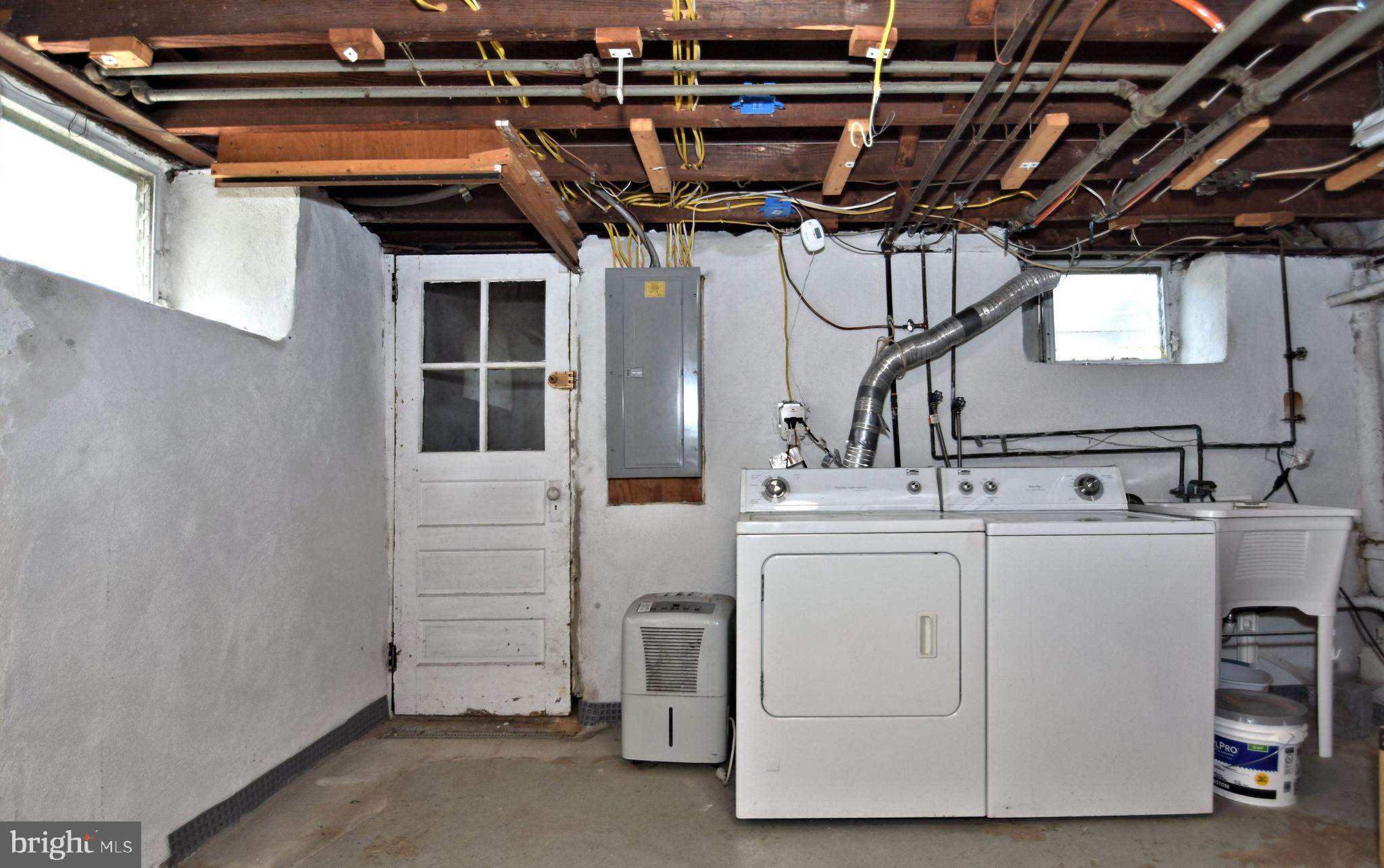 318 Ballymore Road Springfield, PA 19064 - Photo 32 of 41 basement laundry area and walk out / bilco door