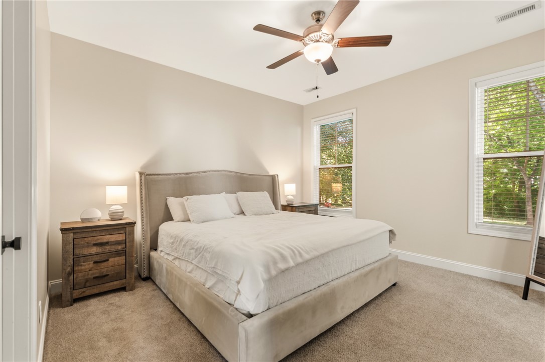 47 A Main Street Pelzer, SC 29669 - Photo 16 of 27 This inviting bedroom features ample natural light and plush carpeting for ultimate comfort.