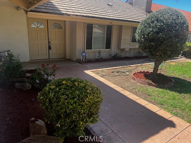 18912 Kinbrace Street Porter Ranch, CA 91326 - Photo 5 of 16 a front view of a house with garden