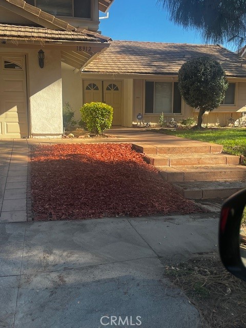 18912 Kinbrace Street Porter Ranch, CA 91326 - Photo 9 of 16 a front view of a house with a yard