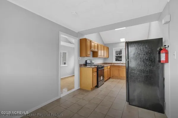 a kitchen with stainless steel appliances a refrigerator and a stove