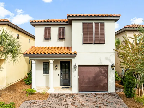 a front view of a house with a garage