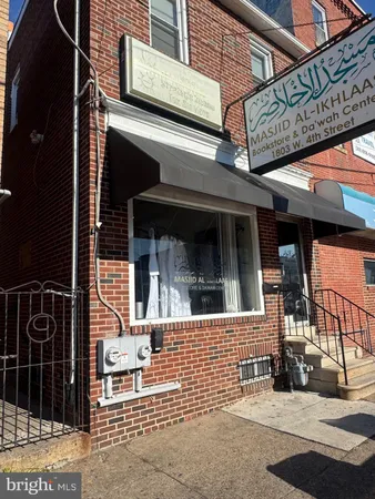 a view of a brick building with a large window