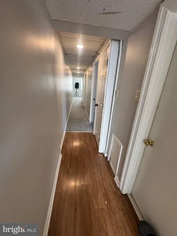 a view of entryway with wooden floor