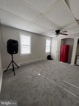 a view of a livingroom with furniture and a window