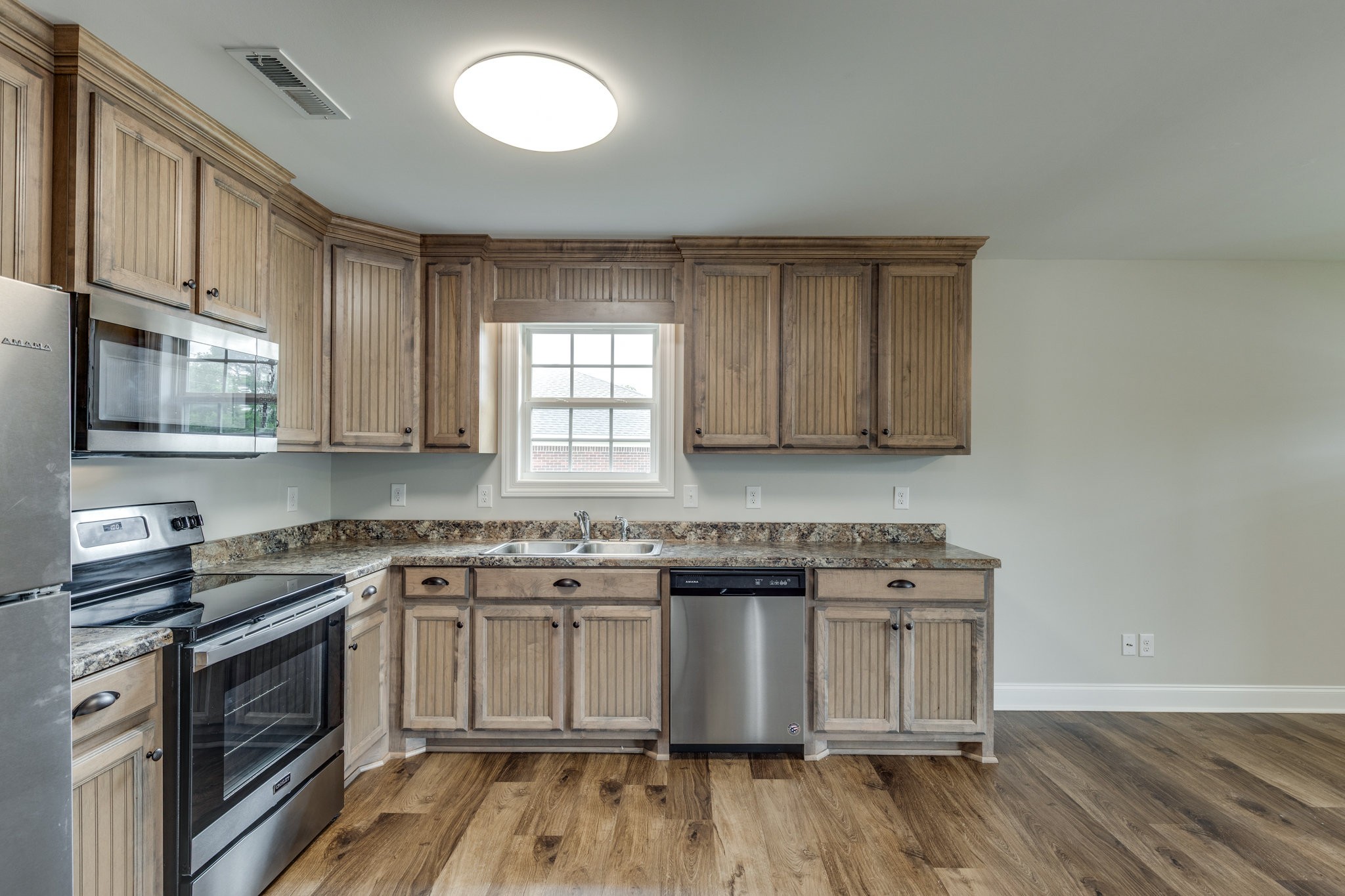 107 Ragsdale Lane Pulaski, TN 38478 - Photo 17 of 25 a kitchen with a stove sink and cabinets