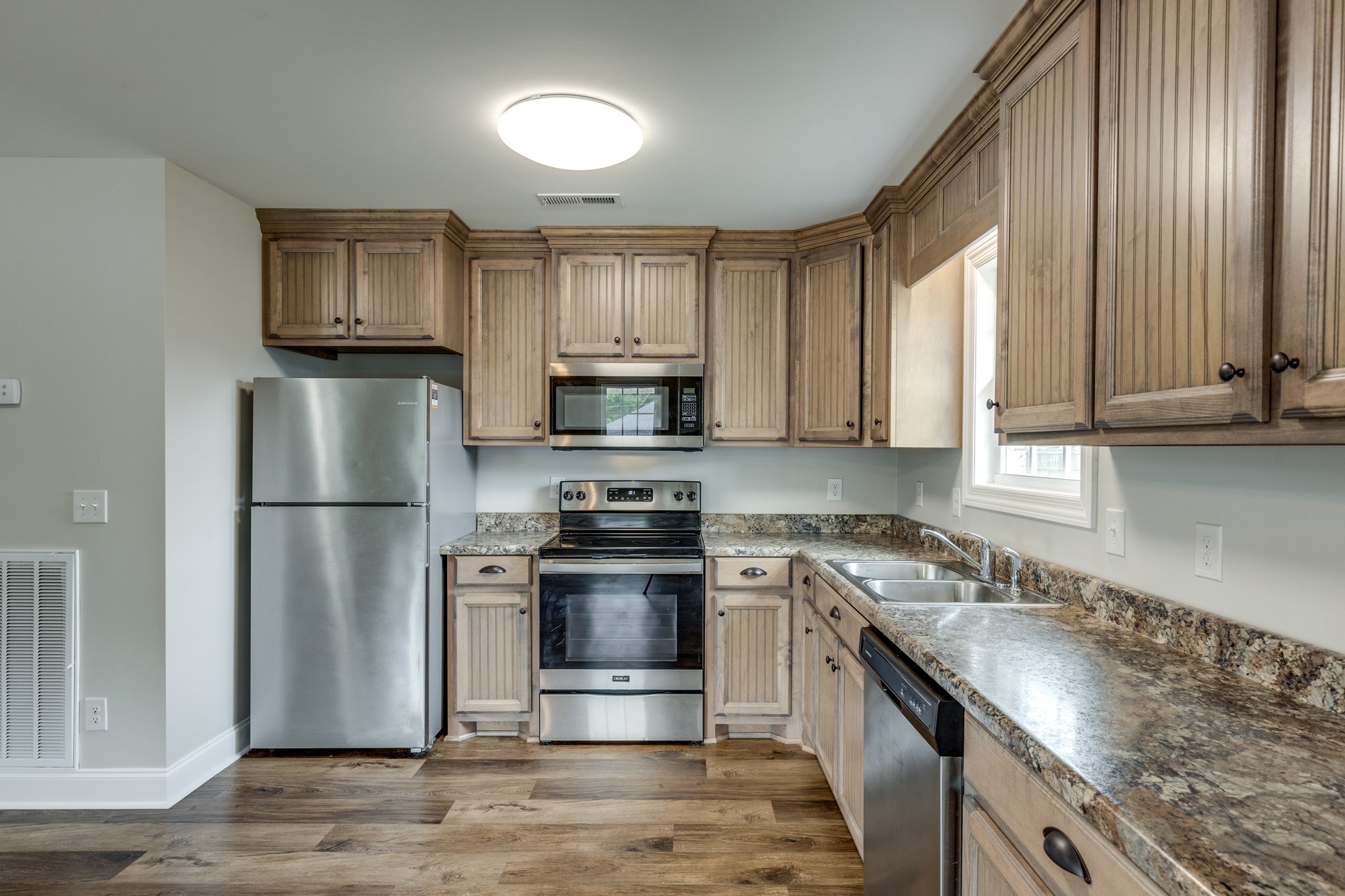 107 Ragsdale Lane Pulaski, TN 38478 - Photo 18 of 25 a kitchen with stainless steel appliances granite countertop a refrigerator stove and sink