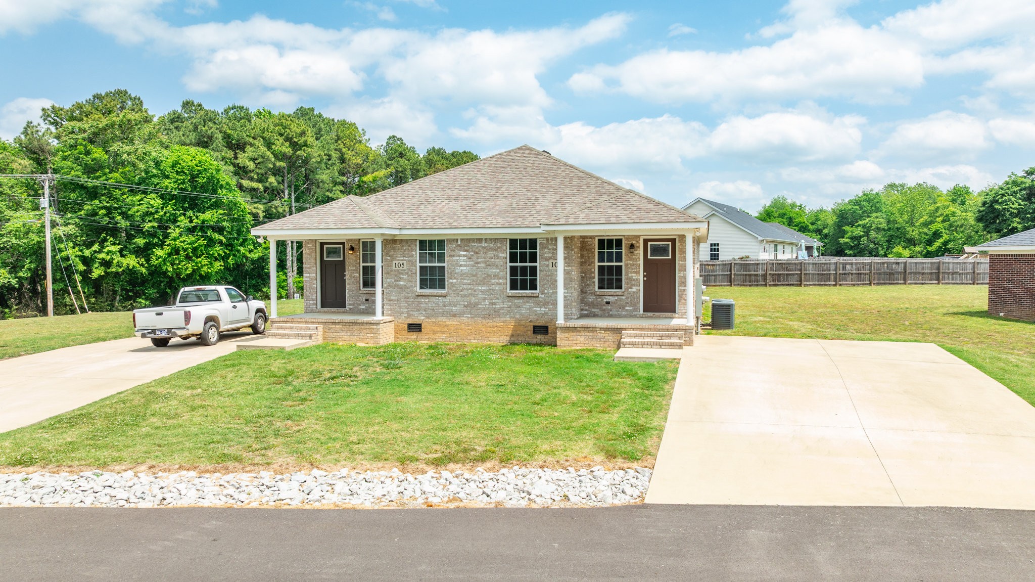 107 Ragsdale Lane Pulaski, TN 38478 - Photo 2 of 25 a front view of a house with a yard and trees