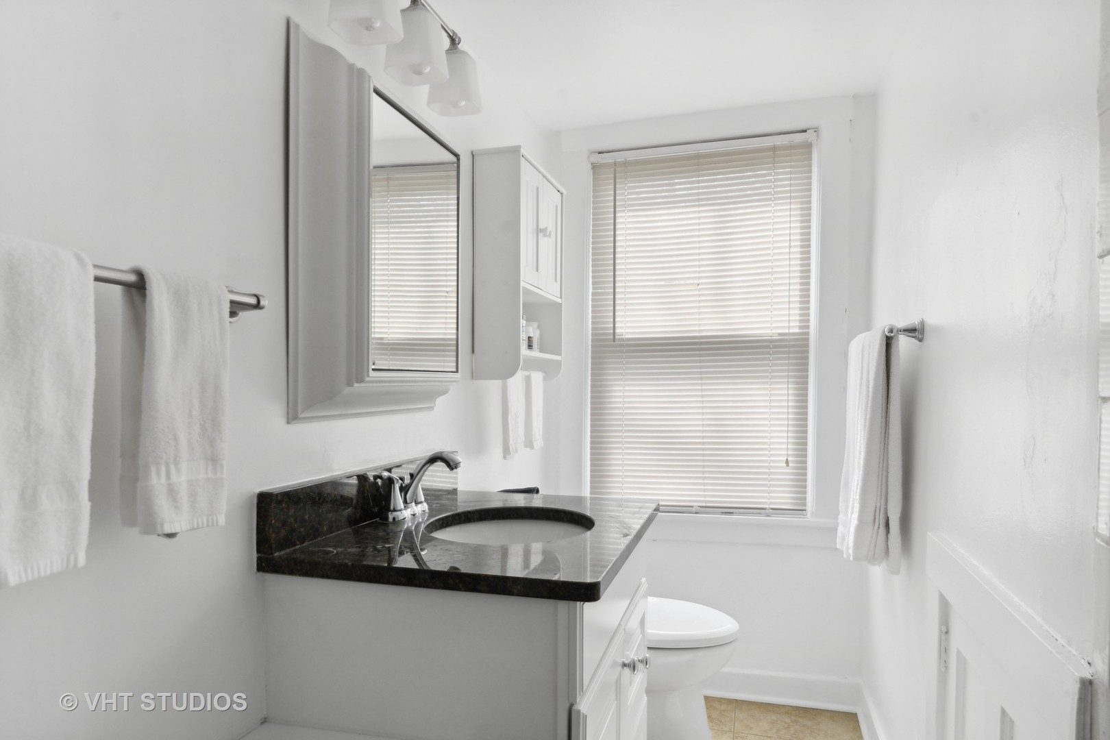 996 Chatfield Road Winnetka, IL 60093 - Photo 12 of 19 a bathroom with a sink and a mirror