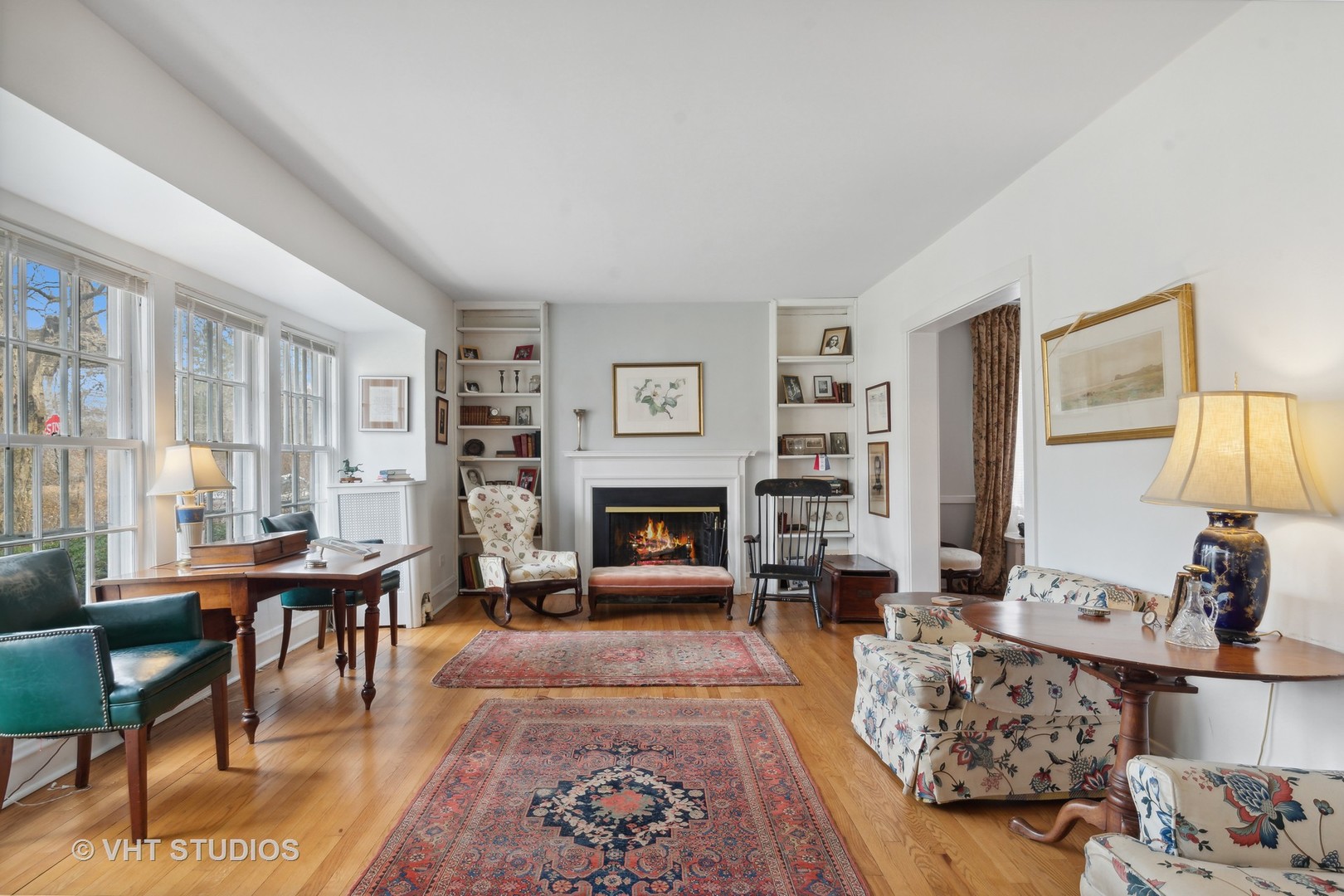 996 Chatfield Road Winnetka, IL 60093 - Photo 4 of 19 a living room with furniture large window and a fireplace