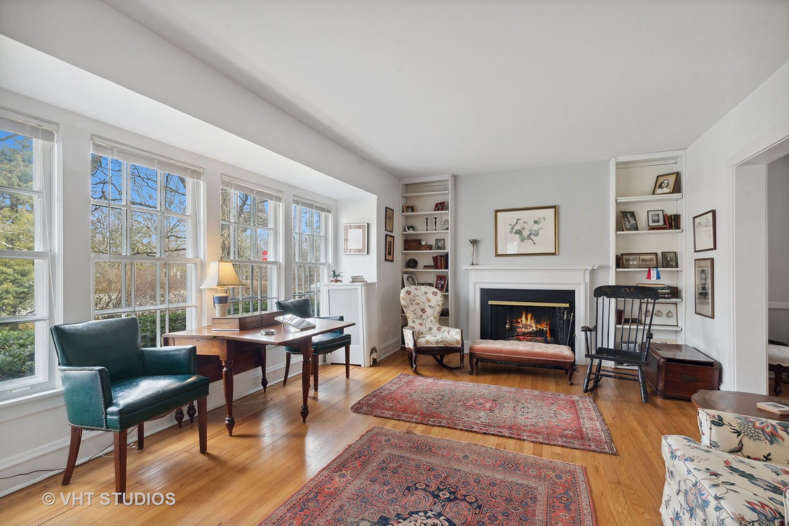 996 Chatfield Road Winnetka, IL 60093 - Photo 5 of 19 a living room with furniture a fireplace and a large window