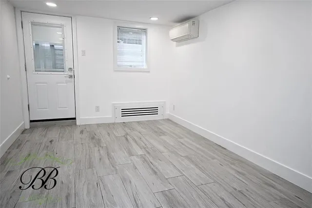 a view of room with wooden floor and window