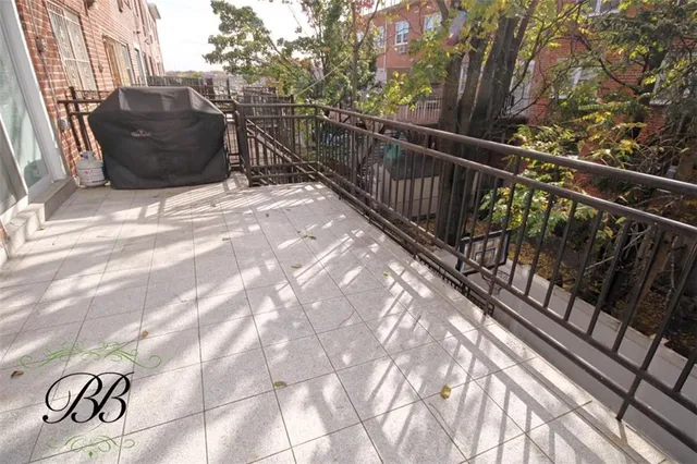a view of balcony with wooden floor