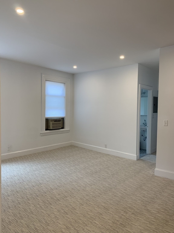 1064 Beacon Street, Unit 9 Brookline, MA 02446 - Photo 14 of 19 a view of empty room with front door